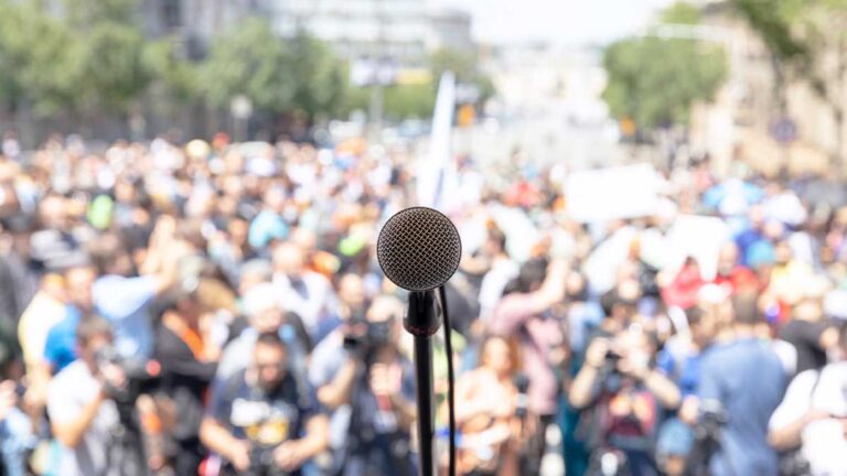 microphone-and-group-of-people-protesting-for-democracy